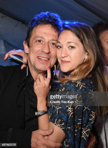 Composer Eric Serra and Julie Peugeot attend the Technikart Boat Party during the 70th annual Cannes Film Festival at on May 22, 2017 in Cannes,...