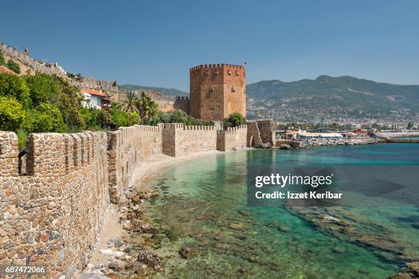 red tower and old walls of the alanya fortress, antalya turkey - antalya city stockfoto's en -beelden