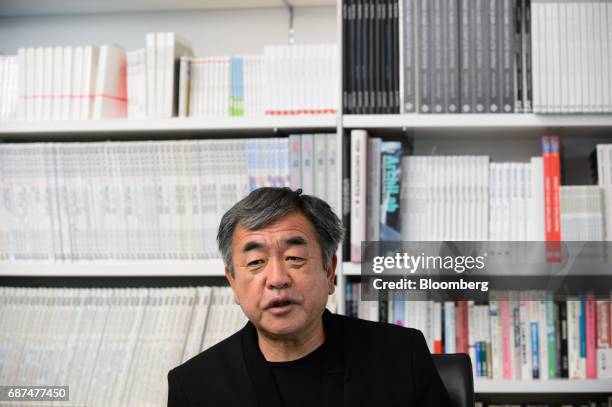 Kengo Kuma, Japanese architect, speaks during an interview in Tokyo, Japan, on Friday, May 12, 2017. Using Japanese lumber for the centerpiece...