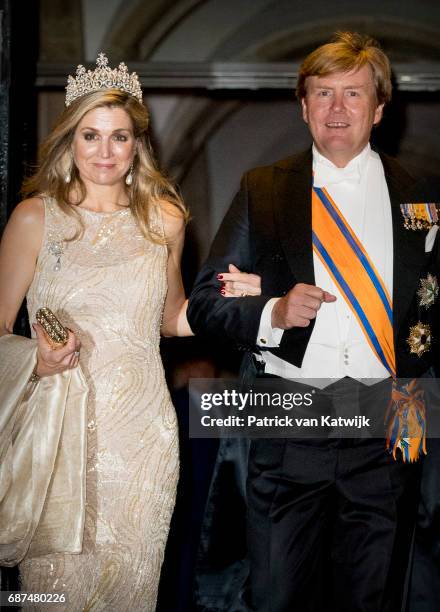 King Willem-Alexander and Queen Maxima of The Netherlands leave after the gala dinner for the Corps Diplomatic at the Royal Palace on May 23, 2017 in...