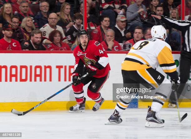 Jean-Gabriel Pageau of the Ottawa Senators stickhandles the puck with pressure from Brian Dumoulin of the Pittsburgh Penguins in Game Six of the...
