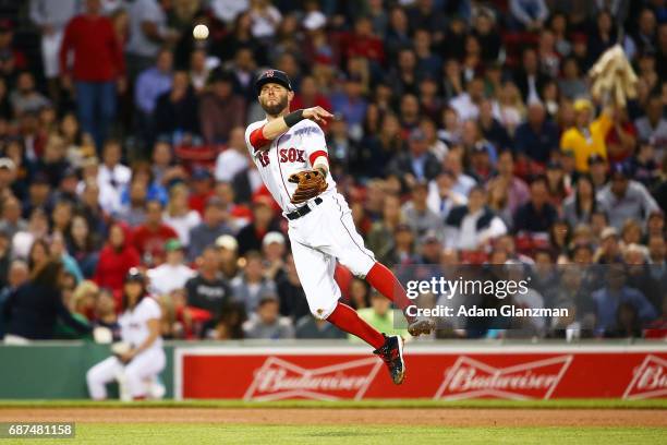 Dustin Pedroia of the Boston Red Sox throws to first base in the fourth inning of a game against the Texas Rangers at Fenway Park on May 23, 2017 in...