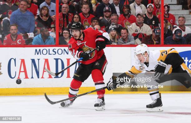 Jean-Gabriel Pageau of the Ottawa Senators fires a shot with pressure from Olli Maatta of the Pittsburgh Penguins in Game Six of the Eastern...