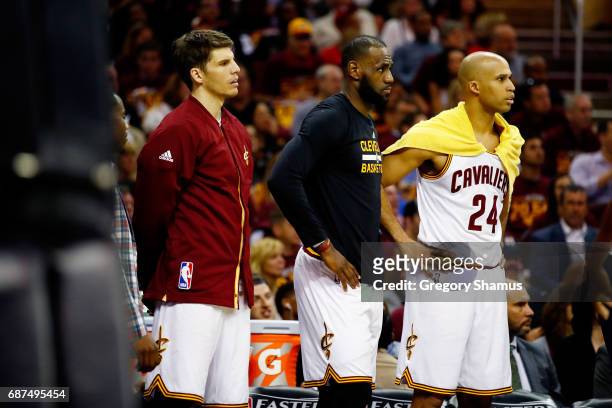 LeBron James and Richard Jefferson of the Cleveland Cavaliers look on from the bench in the first half against the Boston Celtics during Game Four of...