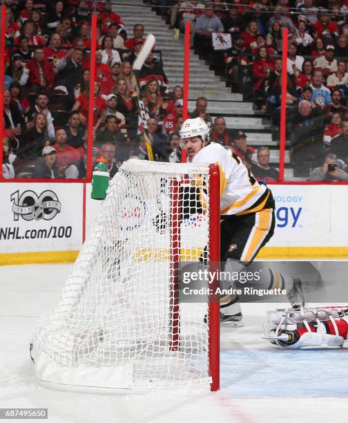 Evgeni Malkin of the Pittsburgh Penguins gets the puck past Craig Anderson of the Ottawa Senators to score a second period goal in Game Six of the...