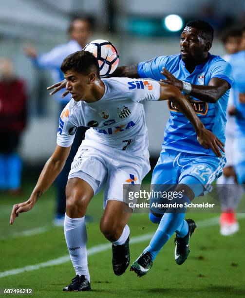 Vitor Bueno of Santos of Brazil and Jair Cespedes of Sporting Cristal of Peru in action during the match between Santos and Sporting Cristal for the...