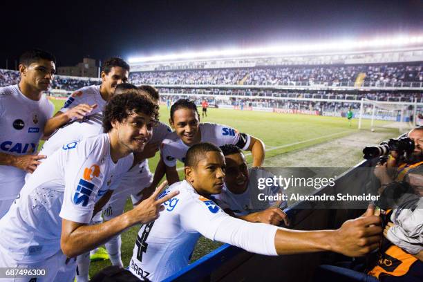 David Braz of Santos celebrates with his team mates after scoring their first goal during the match between Santos and Sporting Cristal for the Copa...