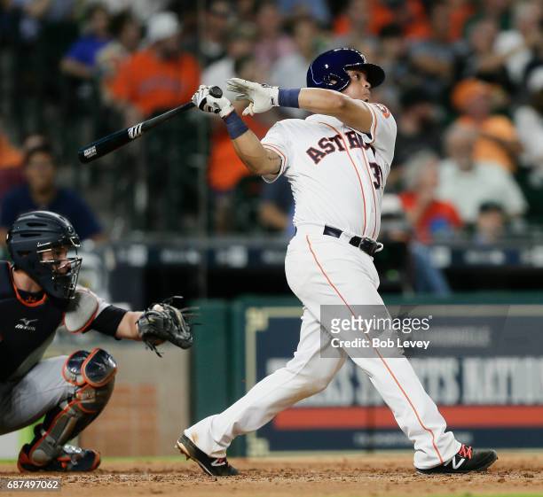 Juan Centeno of the Houston Astros hits a home run in the fourth inning against the Detroit Tigers at Minute Maid Park on May 23, 2017 in Houston,...