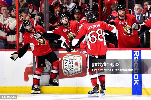 Mike Hoffman of the Ottawa Senators celebrates with teammate Erik Karlsson after scoring a goal on Matt Murray of the Pittsburgh Penguins during the...