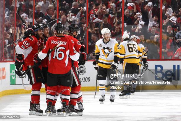 Mike Hoffman of the Ottawa Senators celebrates with his teammate after scoring a goal on Matt Murray of the Pittsburgh Penguins during the third...