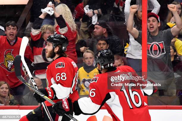 Mike Hoffman of the Ottawa Senators celebrates with his teammate Clarke MacArthur after scoring a goal on Matt Murray of the Pittsburgh Penguins...
