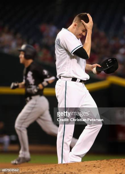 Starting pitcher Patrick Corbin of the Arizona Diamondbacks reacts after giving up a two run home run to Todd Frazier of the Chicago White Sox during...