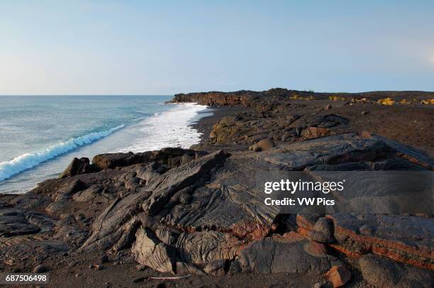 Pahoehoe Lava from Kilauea Eruption at Sunrise, Kaimu Beach at Kalapana, Black Sand Beach, Kaimu Bay, Puna District, Big Island of Hawaii.