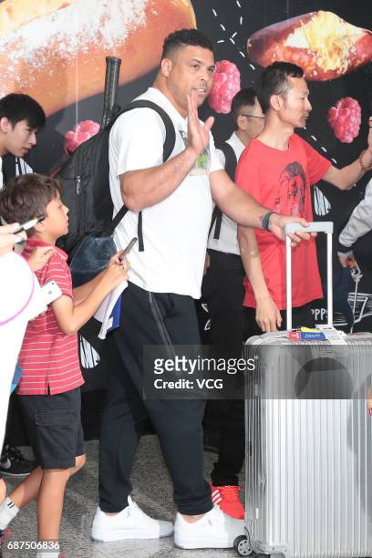 Brazilian football star Ronaldo Luis Nazario de Lima is surrounded by a crowd of fans at the Hong Kong International Airport on May 23, 2017 in Hong...