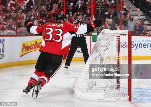 Fredrik Claesson of the Ottawa Senators celebrates after a goal by teammate Mike Hoffman on the Pittsburgh Penguins in Game Six of the Eastern...