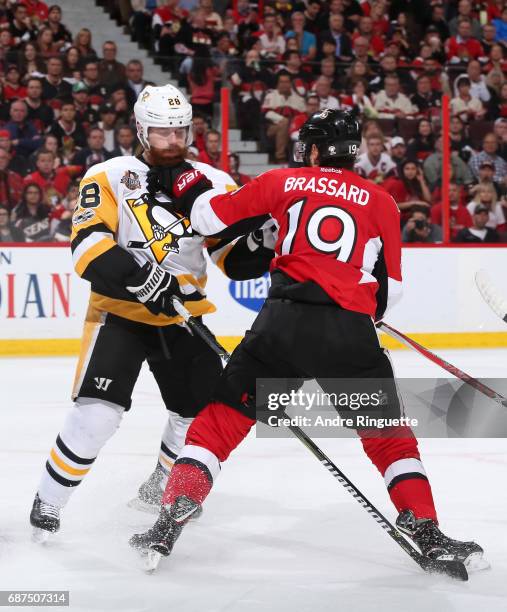 Ian Cole of the Pittsburgh Penguins clashes with Derick Brassard of the Ottawa Senators in Game Six of the Eastern Conference Final during the 2017...