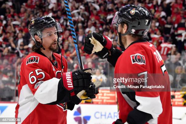 Erik Karlsson of the Ottawa Senators celebrates with Kyle Turris after defeating the Pittsburgh Penguins with a score of 2 to 1 in Game Six of the...