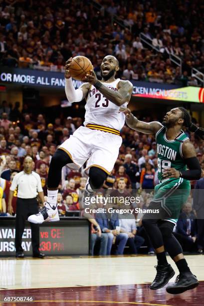 LeBron James of the Cleveland Cavaliers shoots against Jae Crowder of the Boston Celtics in the fourth quarter during Game Four of the 2017 NBA...