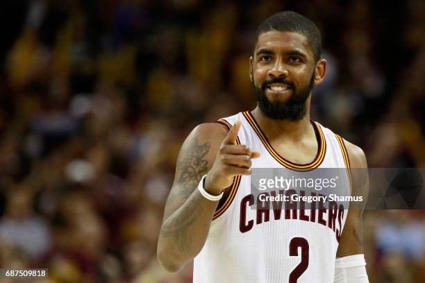 Kyrie Irving of the Cleveland Cavaliers celebrates late in the fourth quarter of their 112 to 99 win over the Boston Celtics during Game Four of the...