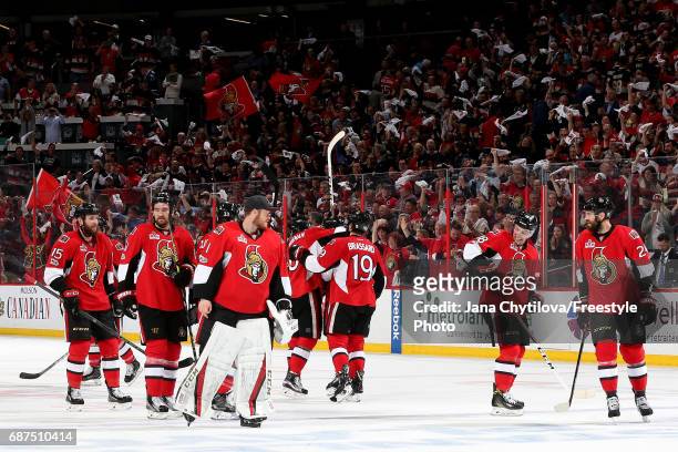 The Ottawa Senators celebrate after defeating the Pittsburgh Penguins with a score of 2 to 1 in Game Six of the Eastern Conference Final during the...