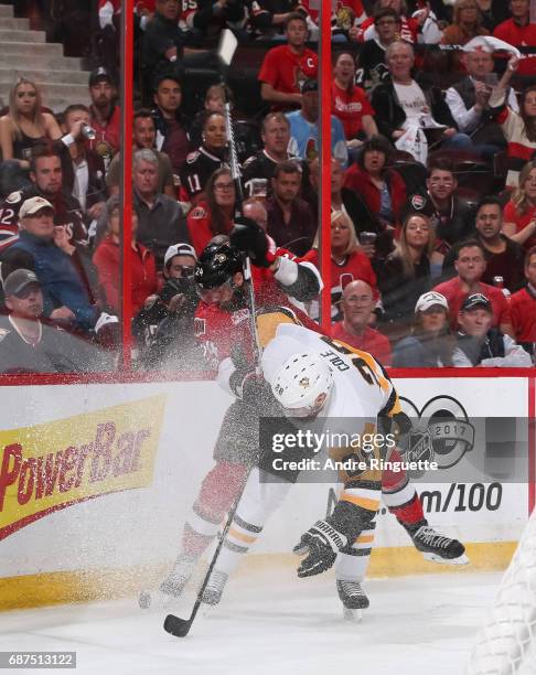 Viktor Stalberg of the Ottawa Senators battles for the puck along the boards with Ian Cole of the Pittsburgh Penguins in Game Six of the Eastern...