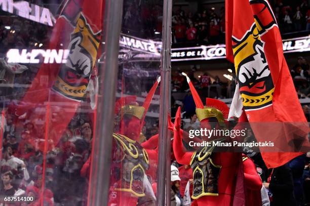 An Ottawa Senators fan cheers after the Ottawa Senators defeated the Pittsburgh Penguins with a score of 2 to 1 in Game Six of the Eastern Conference...