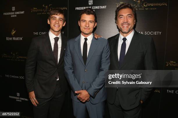 Brenton Thwaites, Orlando Bloom and Javier Bardem attend The Cinema Society with Remy Martin & Frederique Constant host a screening of "Pirates of...