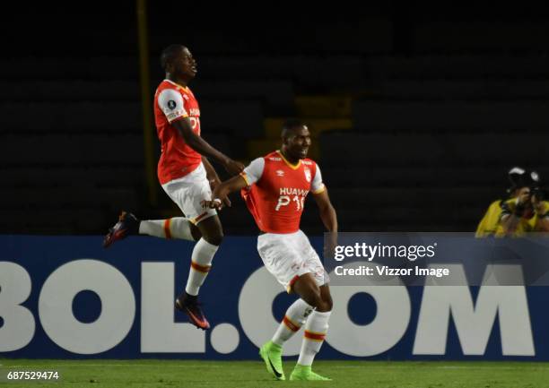 Damir Ceter of Independiente Santa Fe celebrates with teammate after scoring the first goal of his team during a match between Independiente Santa Fe...