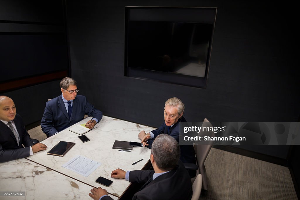 Group of businessmen sitting together in meeting