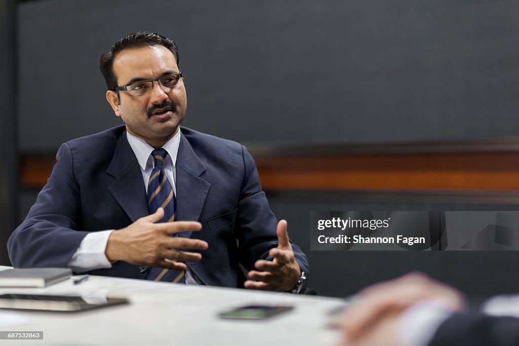 Businessman explaining idea in office meeting