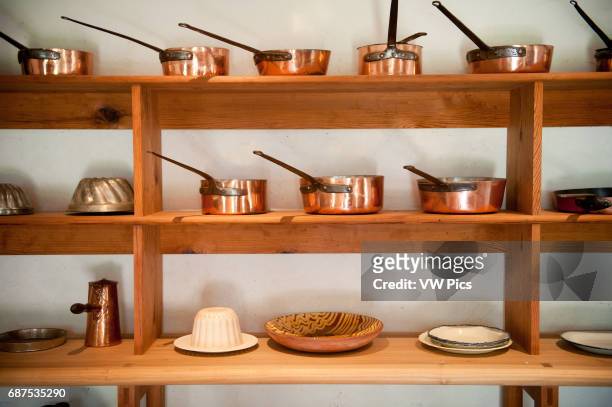 Shelves of copper pots and pans in a kitchen on Thomas Jefferson's Monticello estate in Charlottesville VA.