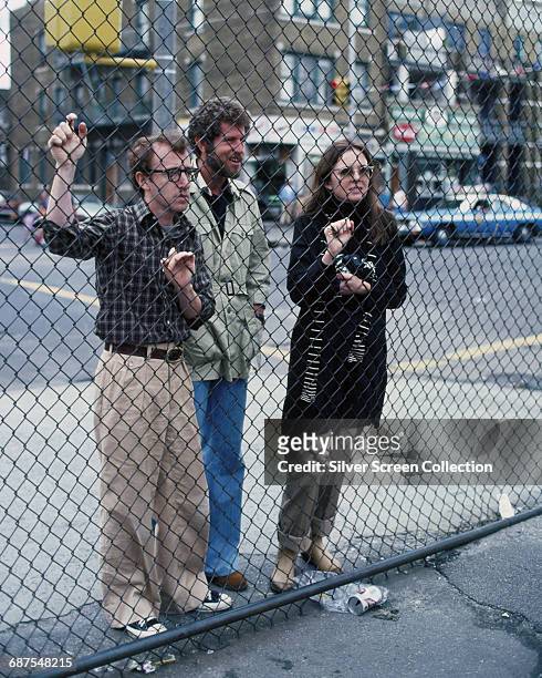 From left to right, actor, writer and director Woody Allen as Alvy Singer, actor Tony Roberts as Rob and actress Diane Keaton as Annie Hall in the...