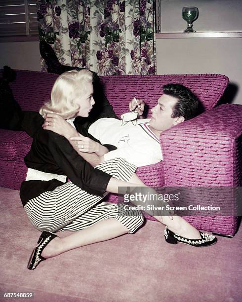 Married American actors Tony Curtis and Janet Leigh , circa 1955.