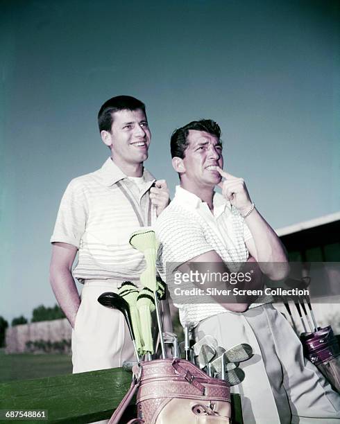 Actor and comedians Jerry Lewis and Dean Martin out playing golf, circa 1952.