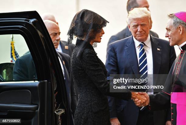 President Donald Trump and his wife Melania are welcomed by the prefect of the papal household Georg Gaenswein as they arrive at the Vatican for a...