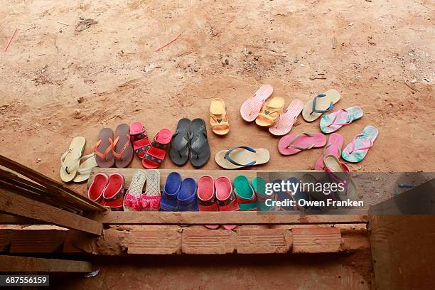 sandals outside a rural classroom - above the threshold stockfoto's en -beelden