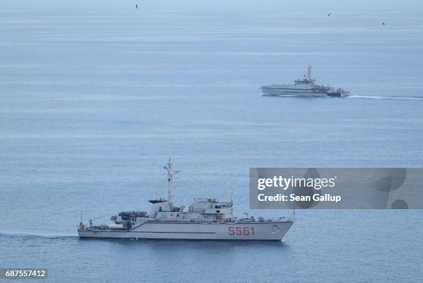 An Italian Navy boat and a boat of the Guardia di Finanza law enforcement agency patrol near the historic town of Taormina, which will host the...