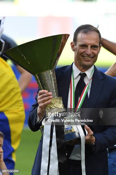 Juventus FC head coach Massimiliano Allegri celebrates with the trophy after the beating FC Crotone 3-0 to win the Serie A Championships at the end...