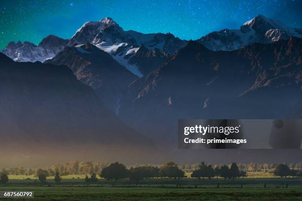 mount cook in lake matheson new zealand with milky way - lake matheson new zealand stock pictures, royalty-free photos & images