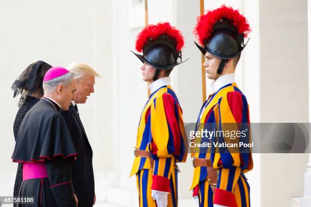 President Donald Trump and his wife First Lady Melania Trump are welcomed by the prefect of the papal household Georg Gaenswein as they arrive at the...
