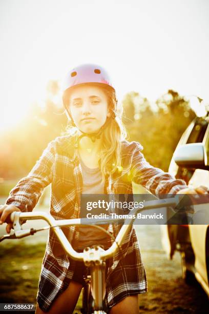 portrait of teen girl on bmx bike - teenagers only stock pictures, royalty-free photos & images