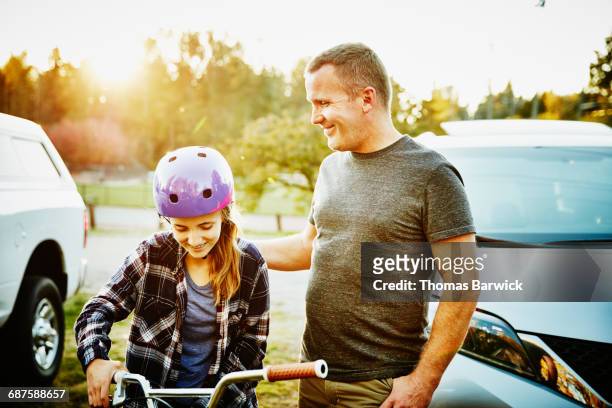 father and teenage girl hanging out - leanintogether stock pictures, royalty-free photos & images
