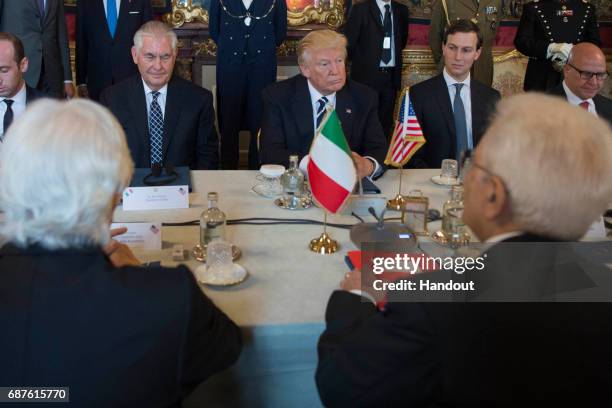 In this handout image provided by Ufficio Stampa e Comunicazione della Presidenza della Repubblica, US President Donald Trump and Italian President...