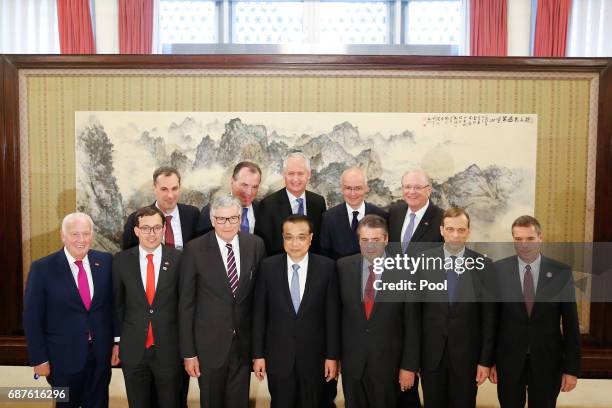 Chinese Premier Li Keqiang and German Foreign Minister Sigmar Gabriel pose with the German delegation at the Zhongnanhai Leadership Compound on May...