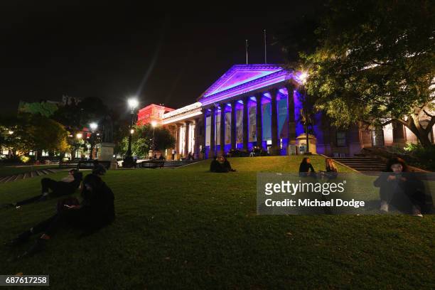 The colors of the Union Jack, the national flag of the United Kingdom, are projected on to the Victoria State Library as a tribute to Manchester...