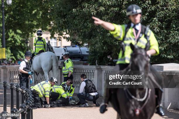Man is detained by police near Buckingham Palace on May 24, 2017 in London, United Kingdom. The Changing of the Guard ceremony has been cancelled...