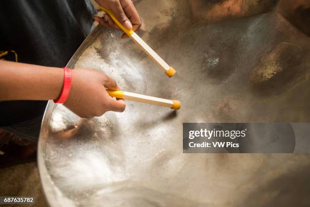 Close-up of man's hands playing a steel drum in Baltimore, Maryland.