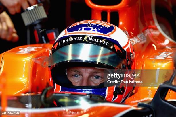 Jenson Button of Great Britain and McLaren Honda during a seat fitting in the garage during previews for the Monaco Formula One Grand Prix at Circuit...