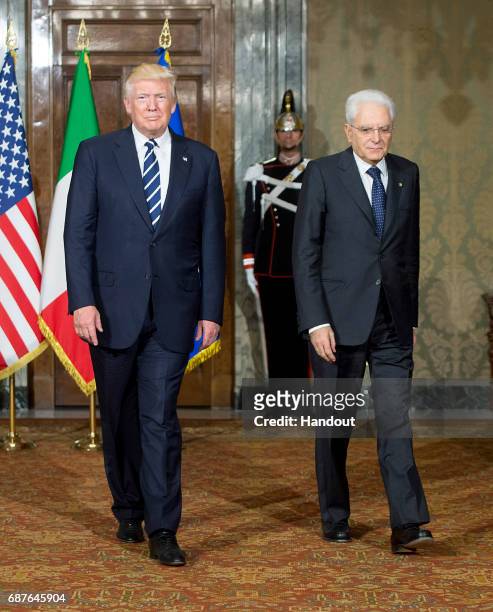 In this handout image provided by Ufficio Stampa e Comunicazione della Presidenza della Repubblica, US President Donald Trump and Italian President...