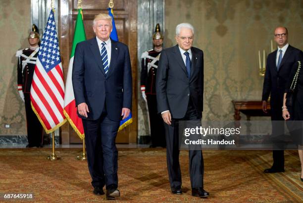 In this handout image provided by Ufficio Stampa e Comunicazione della Presidenza della Repubblica, US President Donald Trump and Italian President...